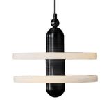 The Nyxara LED Small Double Tiered Alabaster Single Pendant Light features a modern matte black design with a cylindrical center and two soft white horizontal tiers suspended by a black cord.