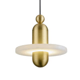 The Nyxara LED Small Tiered Alabaster Single Pendant Light features a gold-textured top and bottom, a flat frosted white ring, and soft white light. This modern pendant hangs elegantly from a single black cord.