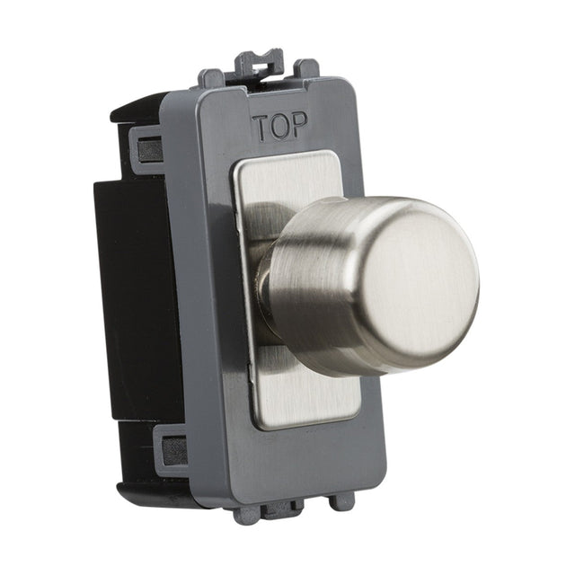 A 6A 1 Gang 2-Way Dummy Dimmer Module in brushed chrome, featuring a cylindrical knob on a rectangular mounting plate with "TOP" indicated at the top. It includes a push on/off switch set in a dark frame and is designed for wall installation.