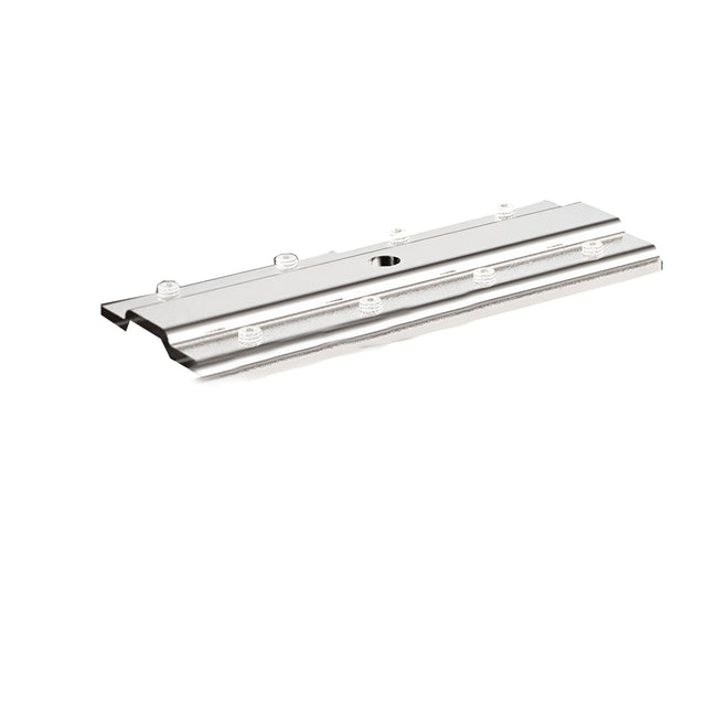 The Sparx Mounting Plate For Track Lighting Systems, a silver metallic grooved panel designed specifically for lighting installation, is placed flat against a white background. This rectangular mounting plate includes several small holes across its surface and a central circular opening, making it perfect for track lighting setups.