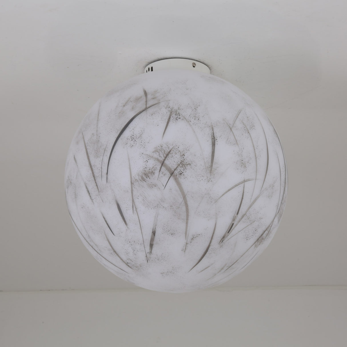 The Lunar Flush Ceiling Light - White features a round, frosted glass shade with hand-painted gray abstract brushstrokes, mounted flush to the ceiling for soft ambient illumination.