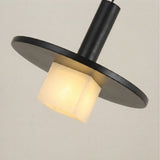 Norevia Cube Alabaster Pendant Light in Matte Black, with a wide black disc canopy and slim stem above a glowing square alabaster shade, shown on a plain light background.