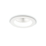The Radiara-1 Round LED Recessed Downlight features a minimalist circular design with a die-cast aluminium construction, a white rim, and a textured reflective interior. Positioned against a plain white background while turned off, this 10W light at 3000K offers an elegant and modern aesthetic ideal for contemporary spaces.
