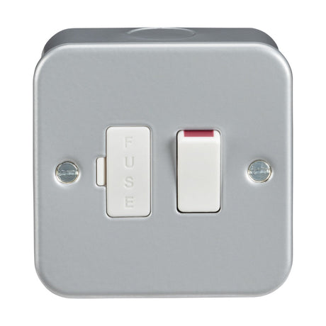 The Metal Clad 13A Switched Spur Unit is a robust, square electrical switch box made of premium-grade steel, featuring a switched fused spur. The white switch includes a red accent, and the fuse compartment is clearly labeled as FUSE. It is secured in place by two visible screws.