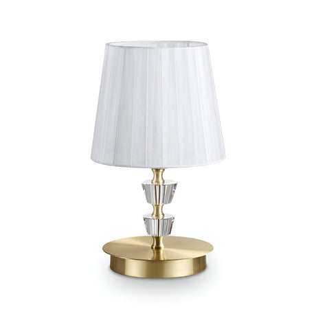 Introducing the Solum Small Table Crystal Lamp - Brass, featuring a modern design with a pleated white lampshade and a sleek brass base. The luxurious lighting experience is enhanced by crystal accents adorning its stem, creating an elegant aesthetic against a plain white background.