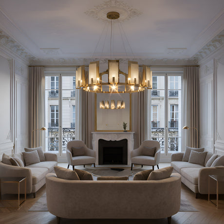 Elegant living room with ornate white walls, high ceiling, and large windows. Two beige sofas and four armchairs encircle a round coffee table by the fireplace, beneath the Aurevon 8 Light Circular Alabaster Chandelier in soft white & copper.