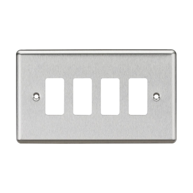 The 4 Gang Grid Faceplate - Rounded Edge Brushed Chrome is designed with four rectangular openings for switches. It has a brushed metal texture and two screw holes for mounting, embodying a sleek and modern design.