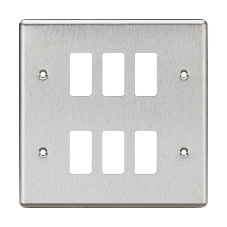 The 6 Gang Grid Faceplate - Rounded Edge Brushed Chrome features six rectangular openings in a layout of two columns and three rows, with four screw holes at the corners for easy mounting. Its brushed chrome finish provides a sleek appearance.