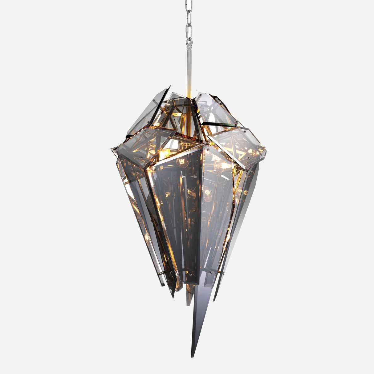 Introducing the Shard 8 Light Smoked Glass Suspension Light - Black: a contemporary chandelier featuring angular metallic facets and a sleek smoked glass-like appearance. Suspended from a chain, this statement piece casts a warm ambient glow, embodying the essence of luxurious lighting.