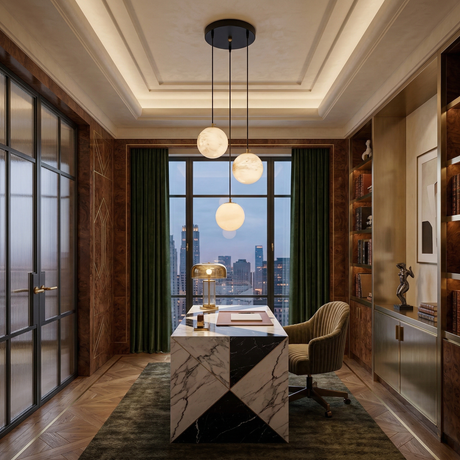 A luxurious office features a marble desk, green velvet chair, sculptural lighting with the Lyvane 3 Light Globe Alabaster Cluster Pendant in soft white and matte black, floor-to-ceiling bookshelves, and city views at dusk.