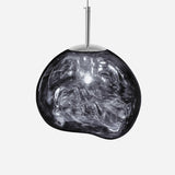 The Ex-Display Lava Large Pendant Light - Silver features a shiny, irregularly shaped semi-transparent smoky glass shade suspended from a slim metal rod, creating a contemporary lighting statement.