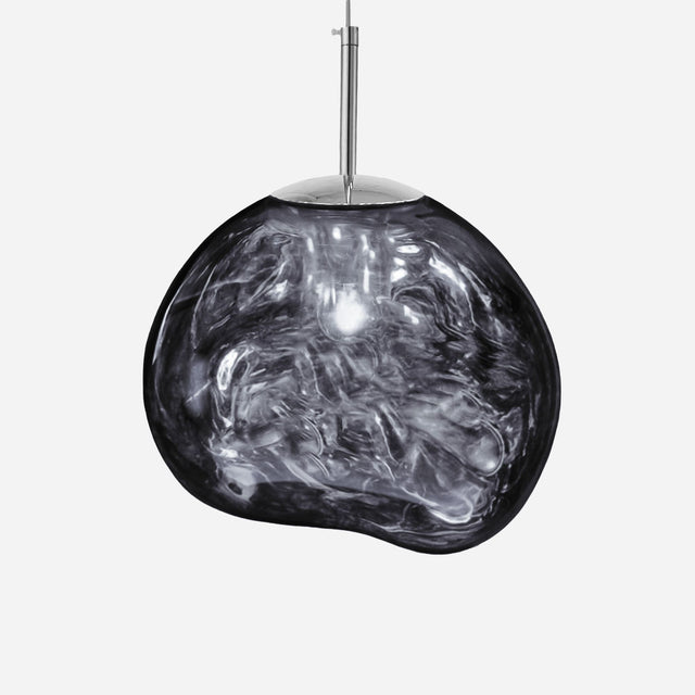 The Ex-Display Lava Large Pendant Light - Silver features a shiny, irregularly shaped semi-transparent smoky glass shade suspended from a slim metal rod, creating a contemporary lighting statement.