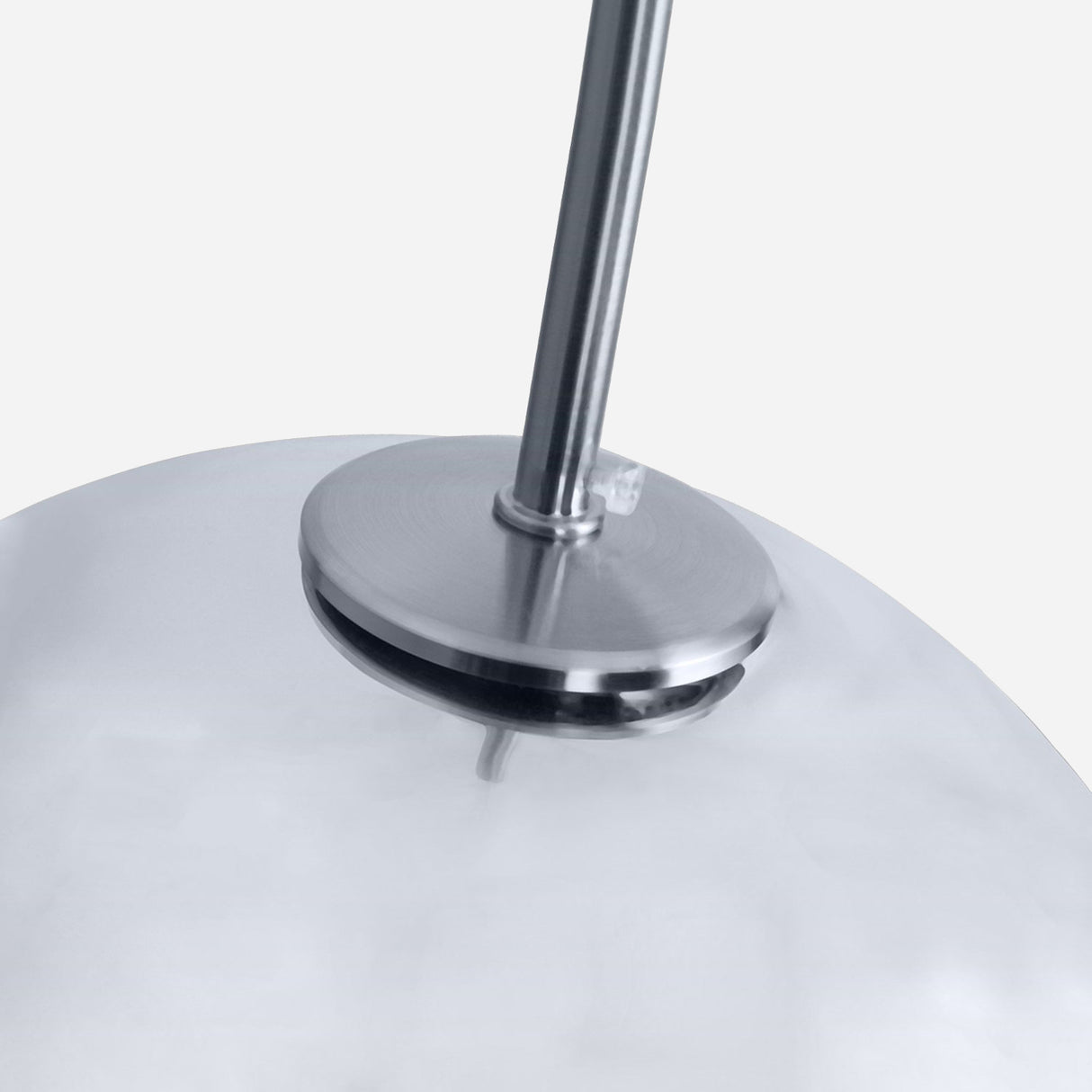 Here is a description using the product data:

Close-up of the Grand Ball Glass Pendant 25cm in Silver, a modern and minimalist ceiling light fixture. It features LED-compatible lighting with a smooth, semi-transparent dome-shaped shade and sleek metallic accents. The fixture is attached to a slender metal rod, enhancing its contemporary and stylish appearance.