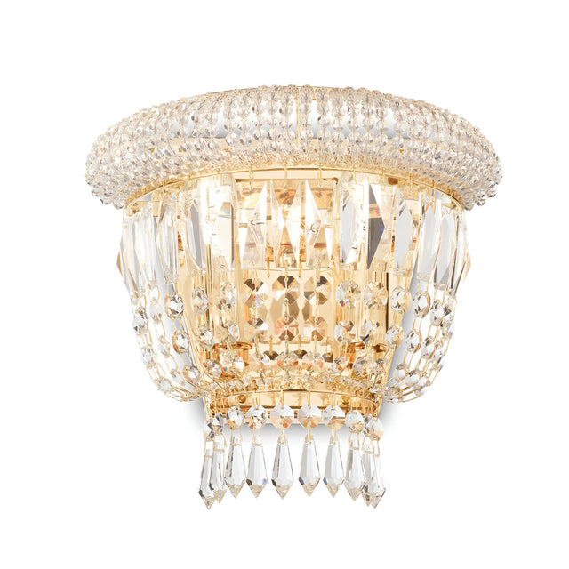 The Emberlit 2 Light Crystal Wall Light - Brass offers a touch of luxury with its detailed crystal elements and dual light feature. The dimmable lighting enhances the shimmering effect as it reflects through the design. Featuring a brass frame, this wall light is elegantly crafted for sophisticated spaces.