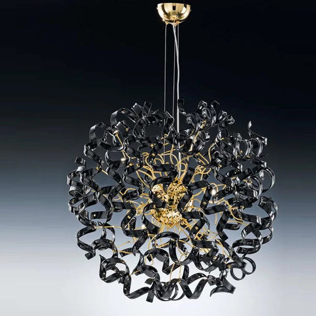 Astro 9 Light Crystal Chandelier with black ribbon-like glass elements swirling around a gold frame, suspended from a gold ceiling canopy against a dark gradient background.