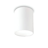 A white cylindrical ceiling light fixture is mounted on a plain, white ceiling, providing an energy-efficient lighting solution. This Lucent LED Round Downlight 25W 3000K - White, 9cm features a smooth, minimalist design with light gently diffusing around the edges, making it ideal for contemporary interiors.
