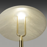 Close-up of the Fuji LED alabaster table lamp's conical shade from below, showing the integrated warm white LED and polished brass fork stem.