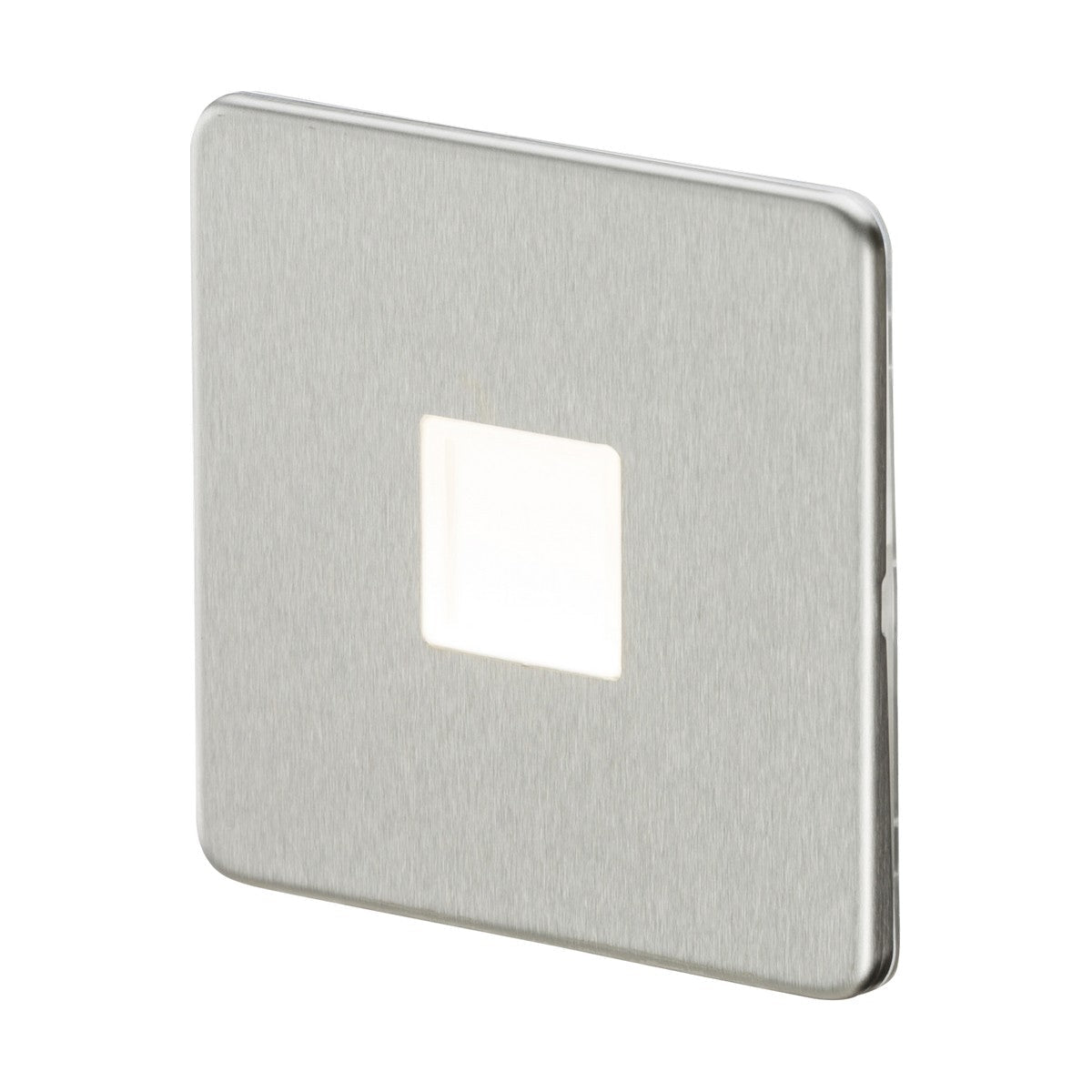 A LED Plinth Light - Brushed Chrome, characterized by its sleek and square metallic design with a brushed chrome finish, is mounted on a white wall. It features a central rectangular white push button, seamlessly enhancing modern LED lighting arrangements with its low-profile fitting.