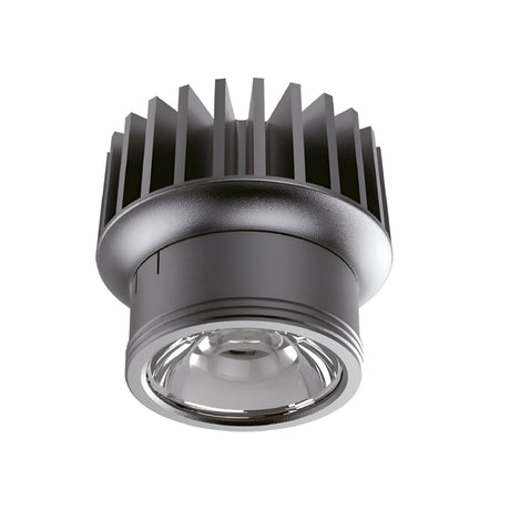 Close-up of the Lumos Outdoor LED Recessed Downlight - 15W, 3000K, Black featuring a cylindrical design with a ribbed heatsink on top and a clear glass lens at the bottom, showcasing an IP54 rating, set against a white background.