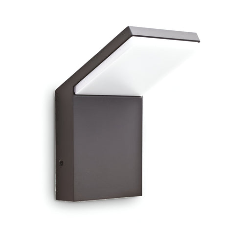 Introducing the Brillix Outdoor LED Wall Light 9W 4000K in an anthracite finish, featuring a sleek and angular design. Its dark rectangular base supports a flat, extended LED panel that provides soft illumination, making it an ideal choice for contemporary outdoor lighting and decor.