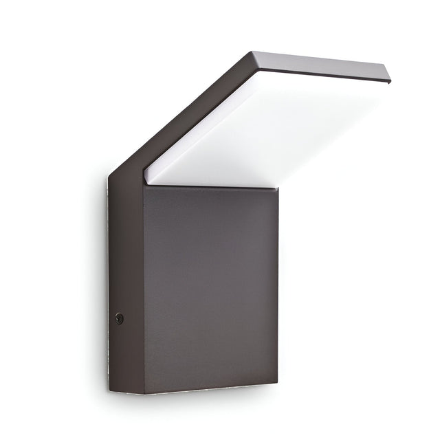 Introducing the Brillix Outdoor LED Wall Light 9W 4000K in an anthracite finish, featuring a sleek and angular design. Its dark rectangular base supports a flat, extended LED panel that provides soft illumination, making it an ideal choice for contemporary outdoor lighting and decor.