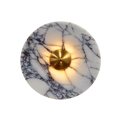 The Carrara LED Small Veined Disc Marble Wall Light in white and black marble with a brushed brass center softly glows, creating warm ambient lighting. Its natural veining and elegant finish make it a stylish wall accent.