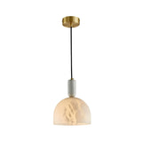 The Belvix 1 Light Medium Dome Alabaster Single Pendant Light features a round brushed brass mount, black cord, white marble detail, and a semi-translucent alabaster shade in soft white.