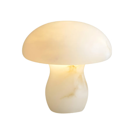The Morfia 1 Light Medium Mushroom Alabaster Table Lamp in Natural Brass features a sculptural mushroom shape with smooth white alabaster and subtle marbling, casting a warm glow against a plain white background.