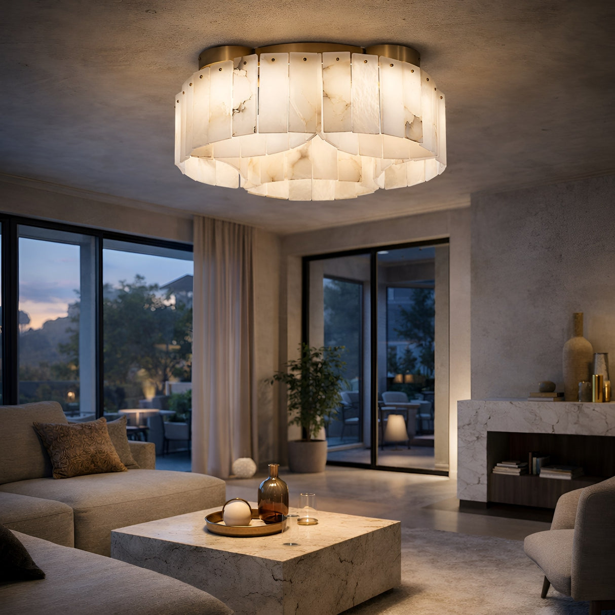 A modern living room with neutral tones features the Elara 10 Light Layer Panel Alabaster Ceiling Semi-Flush Light in Soft White & Brass, plush sofas, a marble coffee table, large windows to the patio and sky, plus plants and minimalist decor.