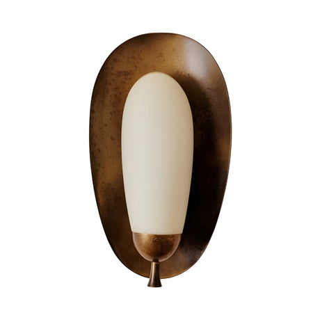 The Orlisse LED Sculpted Alabaster Wall Light features a soft white oval alabaster shade on an asymmetrical brushed bronze backplate with a small metallic accent at the base.