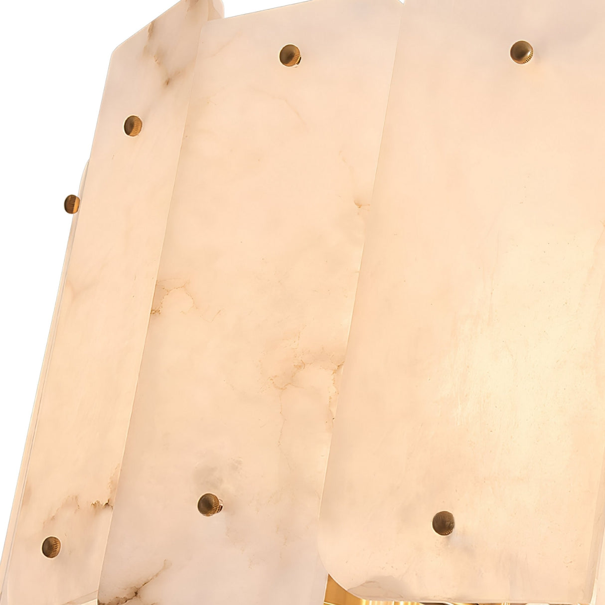 Detail of overlapping rectangular alabaster panels with rounded edges and brass fasteners; the Caldrin 10 Light Tiered Panel Alabaster Chandelier in Soft White & Brass showcases subtle veining and a soft, translucent glow.