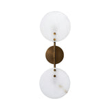 The Althia LED Alabaster Wall Light – Brushed Brass & Soft White features two stacked round alabaster shades on a vertical brushed brass rod with a circular mount, offering an elegant touch to any decorative lighting scheme.