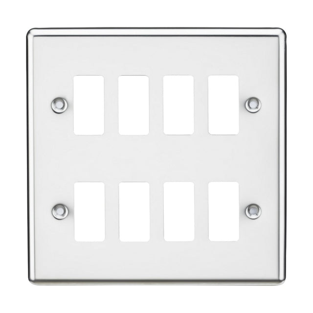 The 8 Gang Grid Faceplate, featuring a polished chrome finish and rounded edges, includes rectangular cutouts for switches. It has four visible screw holes, one in each corner. This simple and modern design is compatible with the Knightsbridge Grid System.