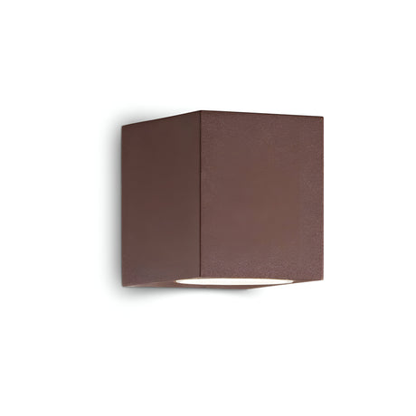 The Aethera Outdoor Wall Light - Brown is a cube-shaped fixture with a modern, minimalist design that emits light from the bottom. It is weather-resistant and mounted on a white background.