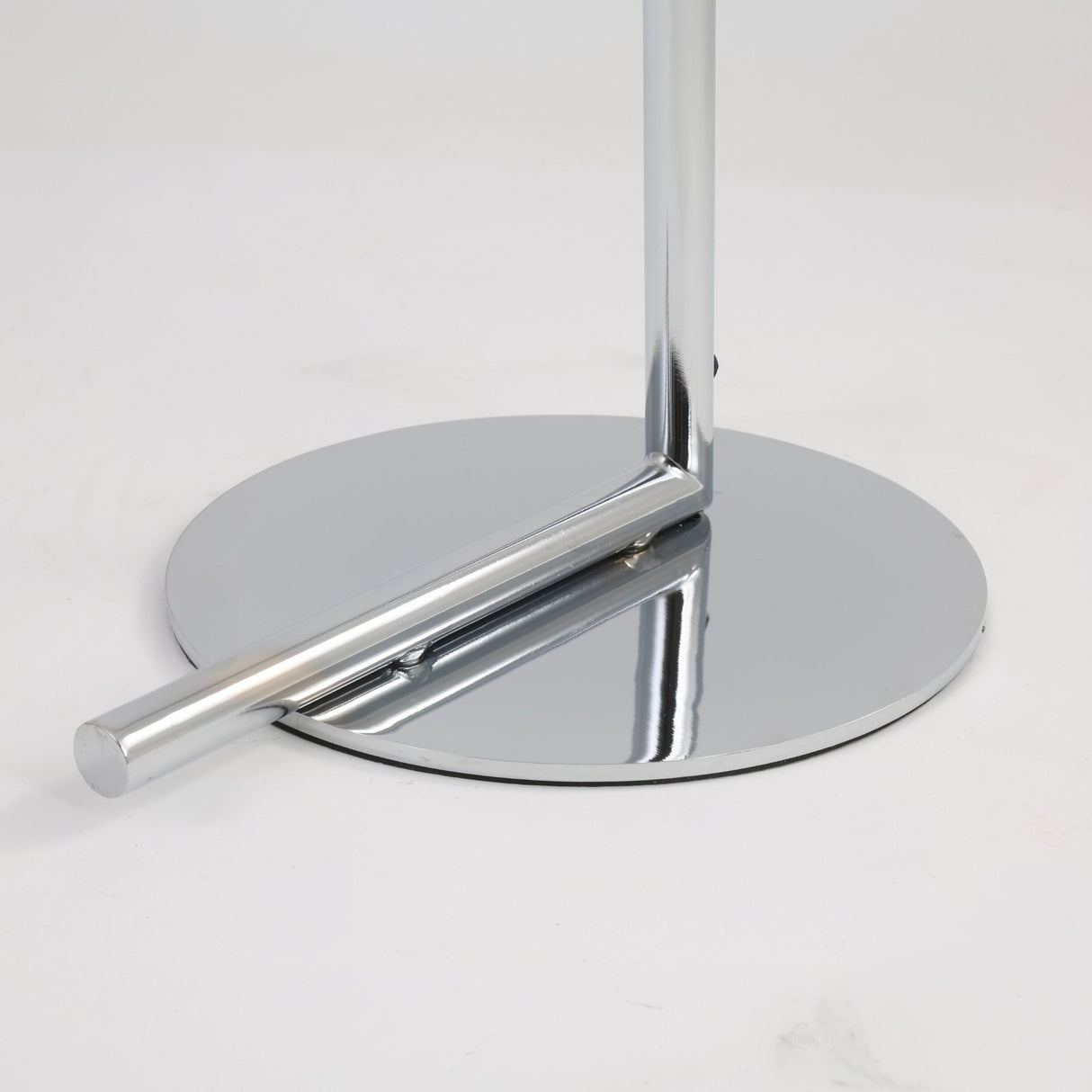 A close-up of the shiny chrome base and support of the Vetra 1 Light Opal Glass Floor Lamp in grey, featuring its vertical pole, set against a plain white background.