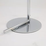 A close-up of the shiny chrome base and support of the Vetra 1 Light Opal Glass Floor Lamp in grey, featuring its vertical pole, set against a plain white background.