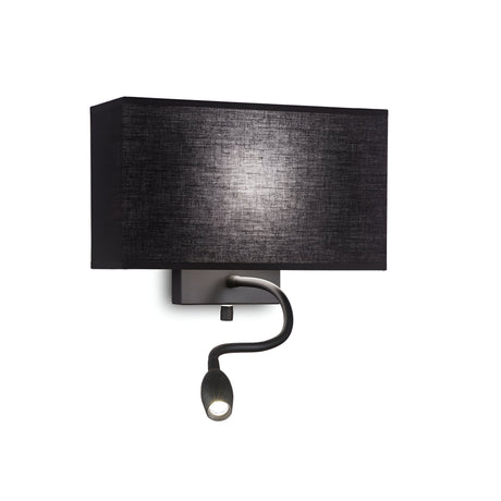 The Solari 2 Light Wall Light - Black is designed with a sleek metallic backplate, a black fabric-covered lampshade, and an adjustable LED reading light, combining style and functionality effortlessly.