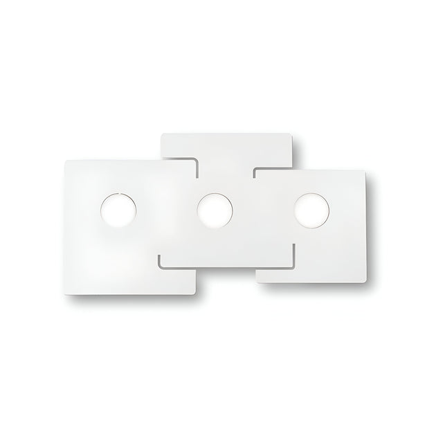 The Emberix 3 Light Ceiling Light - White showcases a design with three interlocking white panels, each featuring a circular cutout at the center. Its minimalist and balanced aesthetic is enhanced by clean lines and subtle shadows, evoking the elegance of modern geometric sculpture.