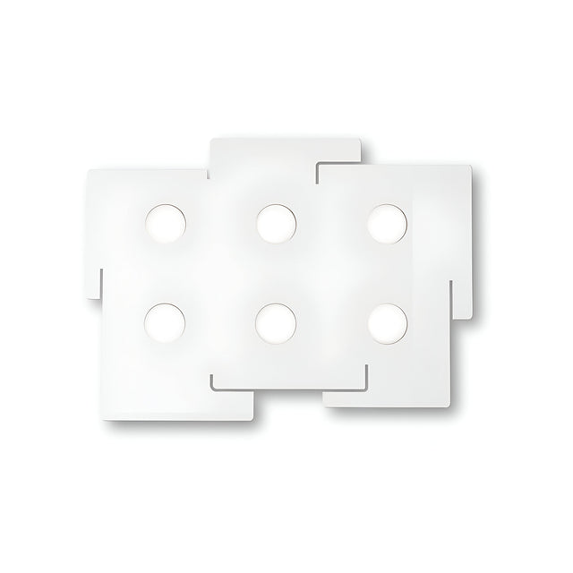 A minimalist rectangular white wall tile, featuring six circular cutouts arranged in two rows of three, exudes a modern aesthetic. The edges interlock like puzzle pieces, creating an intriguing design. Complement it with the Emberix 6 Light Ceiling Light - White to elevate your space's contemporary style.