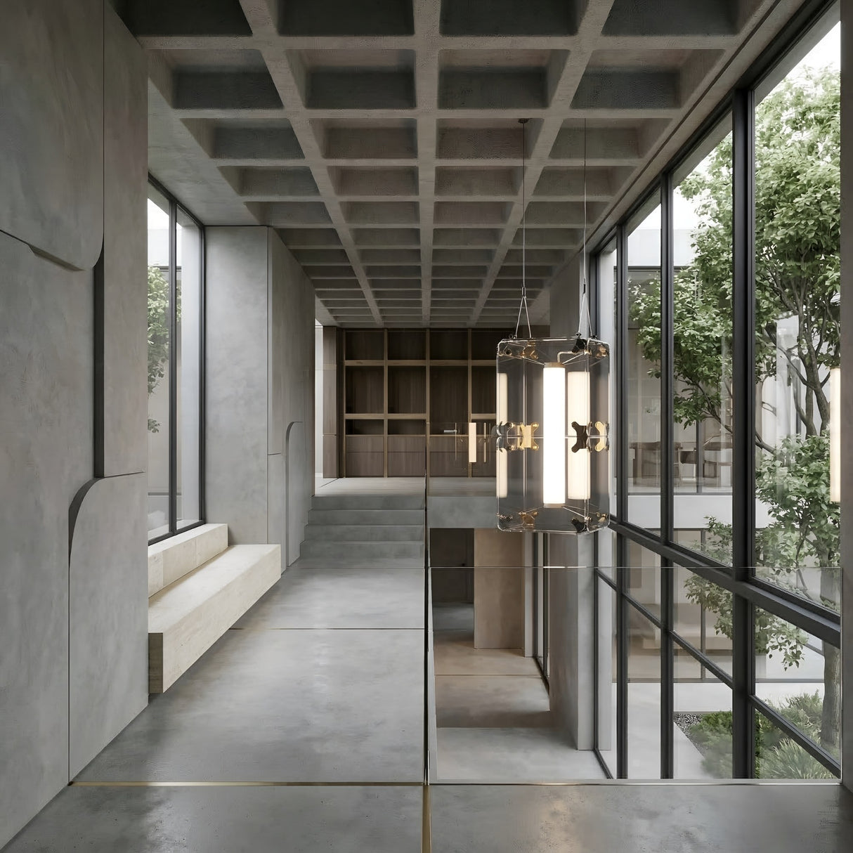 A modern hallway with concrete floors, walls, and waffle ceiling features floor-to-ceiling windows facing a tree courtyard, built-in bench seating, and is illuminated by the Qbic LED Small Pendant Light - Clear.