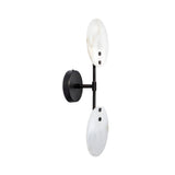 The Althia LED Alabaster Wall Light features a matte black base with two vertically stacked, soft white alabaster disc shades attached by a black rod, presented against a white background.