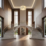 Grand foyer with twin marble staircases, brass railings, tall windows, and wood paneling. The Lunaro 20 Light Tiered Panel Alabaster Chandelier in Brushed Brass & Soft White hangs above the central console table between the stairs.