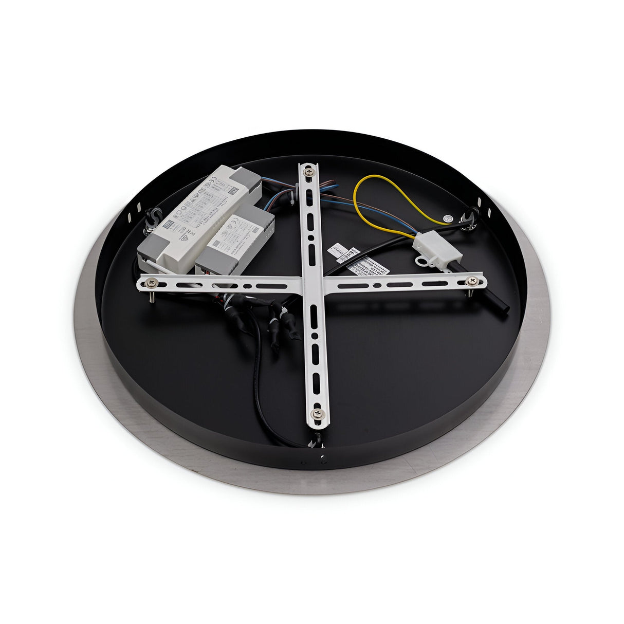 A circular light fixture lies face down, exposing its inner components. Visible are a metallic support frame, wiring, and electrical elements. The fixture combines modern elegance with its round, gold edge and smooth surface, reminiscent of the Fluxa 3 Light LED Cluster Pendant 3000K 60W - Gold.