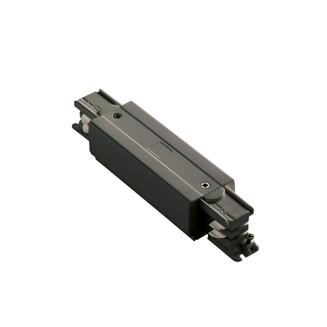 The Brillia Trimless Track Middle Power Input - On-Off in black features visible screws and metal components, expertly crafted for connecting sections of dependable 3-phase track lighting systems. It's presented against a plain white background.