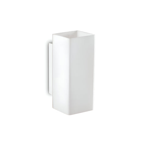 The Starlet Square Wall Light - White is a minimalist rectangular wall sconce characterized by its clean lines and contemporary design. It boasts a smooth matte finish and is mounted on a petite rectangular base, bringing understated sophistication to any area.