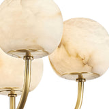 Close-up of three creamy white and beige marbled globes on curved stems, showcasing the elegant Aurelio 10 Light Large Globe Alabaster Chandelier in soft white and brushed brass.