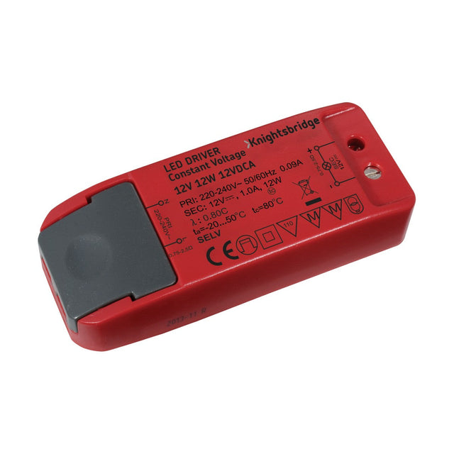 The 12W Constant Voltage LED Driver 12V from Knightsbridge, crafted from durable polycarbonate, showcases important technical details such as a 230V input voltage and a 12V output. This red device includes safety symbols, model information, a gray end cap, and is equipped with a mounting hole.