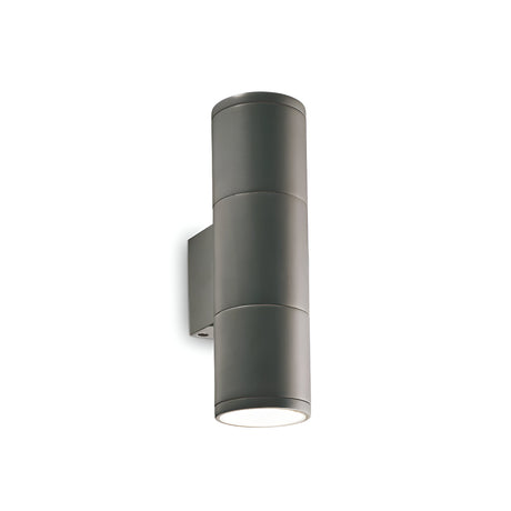 The Solar 2 Light Outdoor Small Wall Light in anthracite boasts a sleek, modern design with durable aluminum construction. It features both upward and downward illumination thanks to its innovative up-and-down lighting design and is mounted on a minimalistic wall bracket.