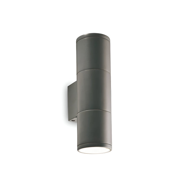The Solar 2 Light Outdoor Small Wall Light in anthracite boasts a sleek, modern design with durable aluminum construction. It features both upward and downward illumination thanks to its innovative up-and-down lighting design and is mounted on a minimalistic wall bracket.
