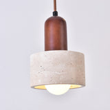 Torvella Travertine Drum Wall Light with a walnut-brown wood fitting and light beige travertine drum shade, showing a bulb glowing beneath, against a plain white background.